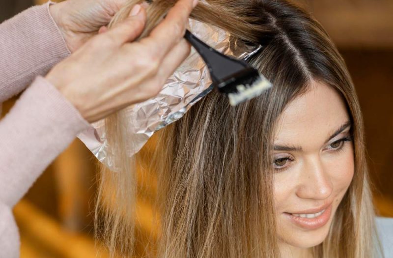 woman-getting-her-hair-dyed-at-home-by-hairstylist